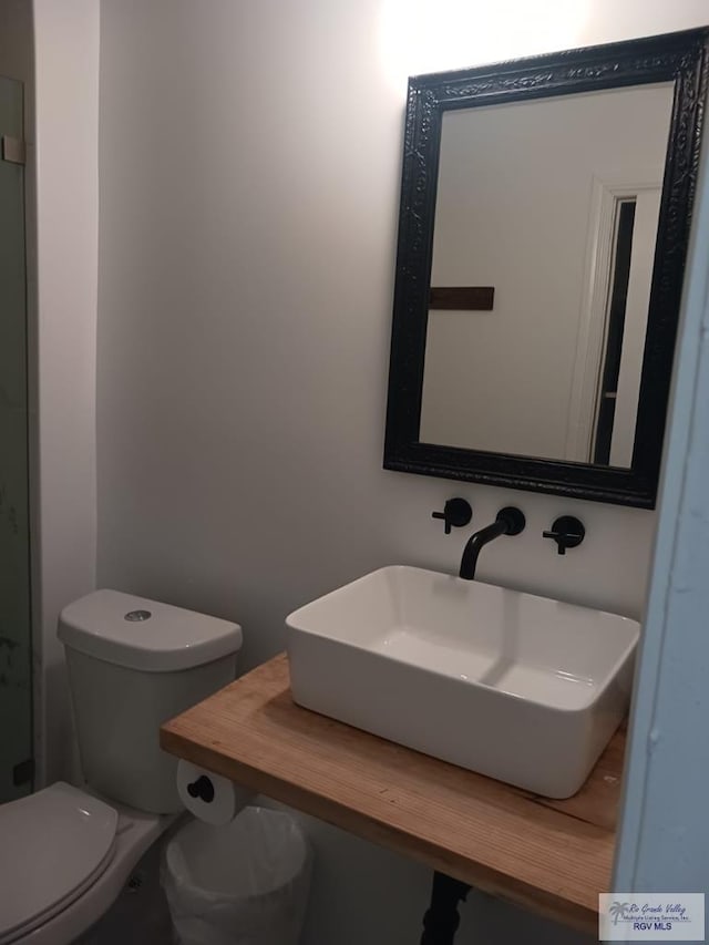 126 E Esperanza St Unit 101, South Padre Island, TX 78597 - bathroom with a sink and toilet