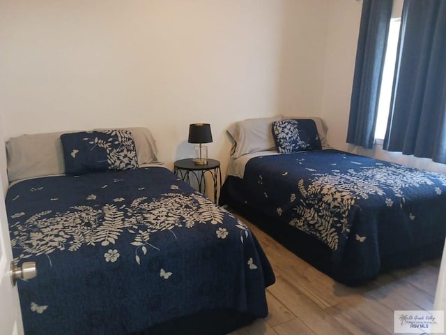 bedroom featuring hardwood / wood-style floors