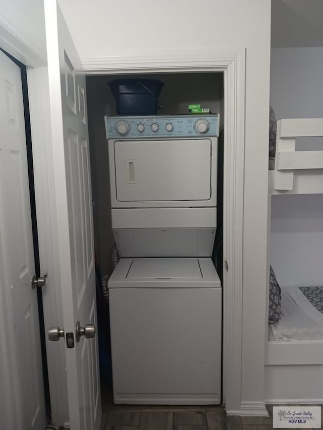 126 E Esperanza St Unit 101, South Padre Island, TX 78597 - laundry room featuring stacked washer / drying machine