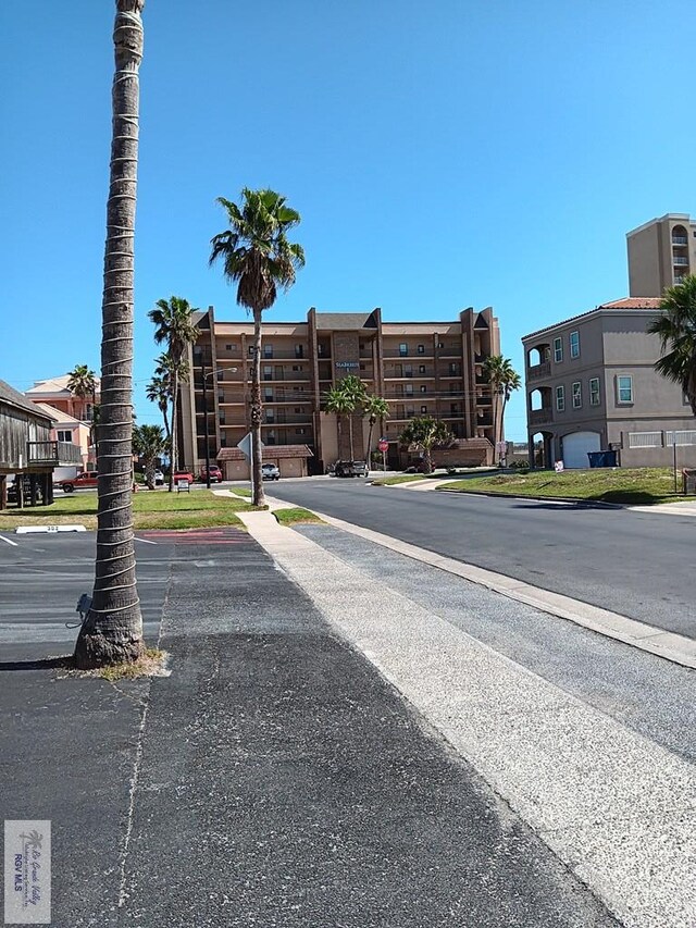 126 E Esperanza St Unit 101, South Padre Island, TX 78597 - view of asphalt street featuring sidewalks and curbs