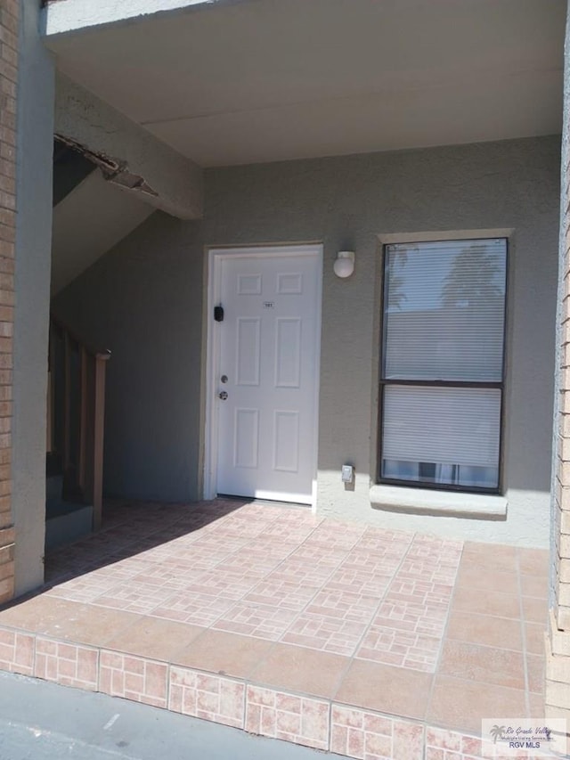 entrance to property with a patio