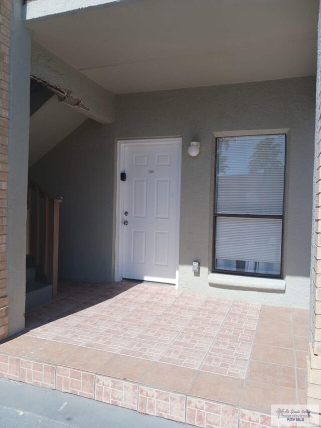 126 E Esperanza St Unit 101, South Padre Island, TX 78597 - entrance to property with stucco siding