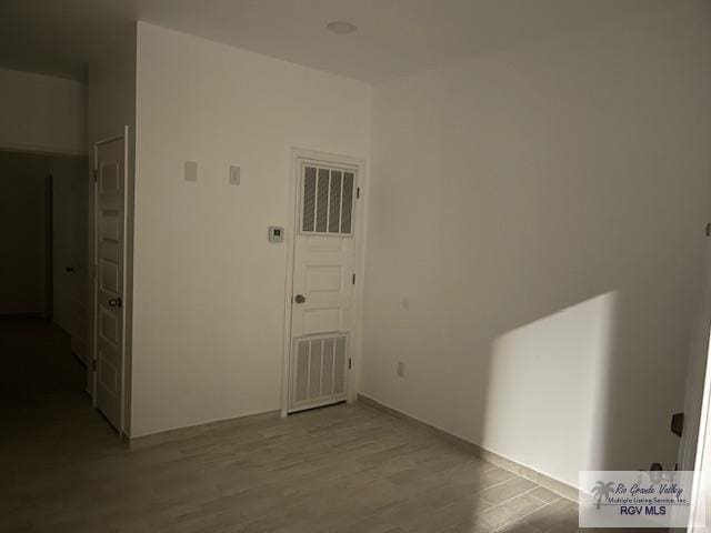 corridor featuring light hardwood / wood-style floors