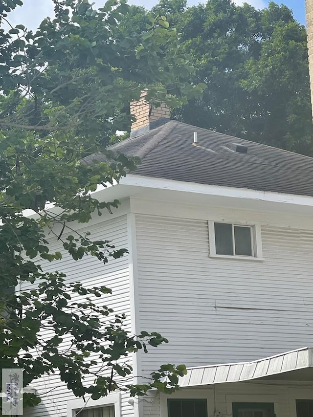 121 E Washington St, Brownsville, TX 78520 - exterior view of a shingled roof and a chimney