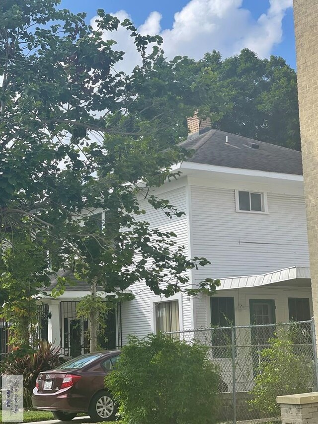 121 E Washington St, Brownsville, TX 78520 - view of property exterior featuring a chimney