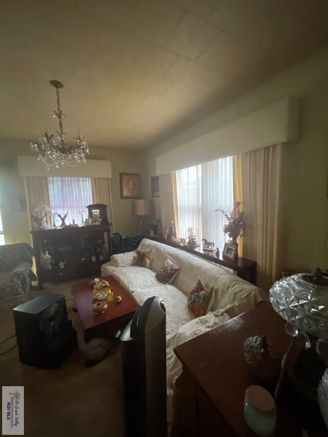 121 E Washington St, Brownsville, TX 78520 - living area with plenty of natural light and a chandelier