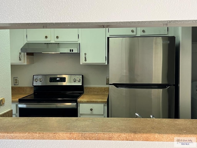 kitchen featuring green cabinets and appliances with stainless steel finishes