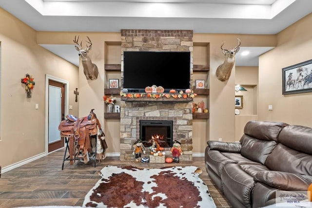 living room featuring a fireplace and dark hardwood / wood-style flooring