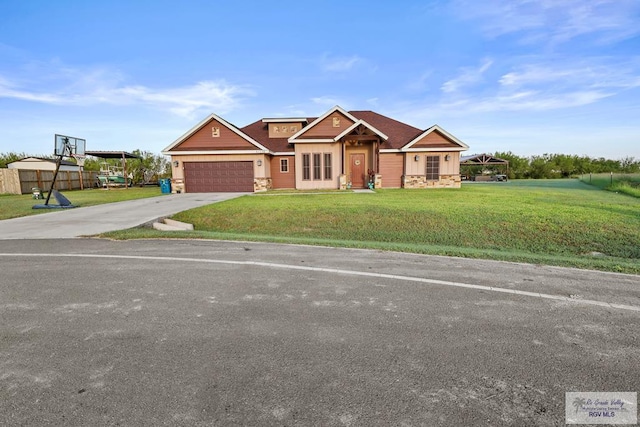 craftsman-style house with a front yard and a garage