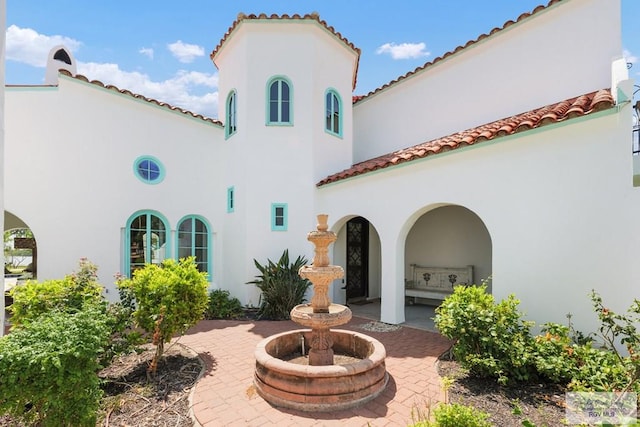 back of property featuring a patio area