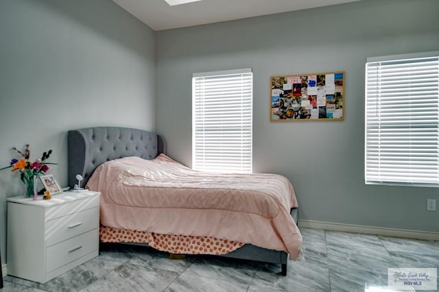 bedroom featuring baseboards