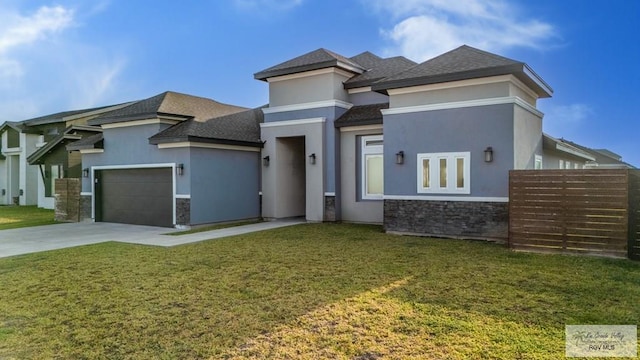 prairie-style home with a garage, stone siding, driveway, and stucco siding