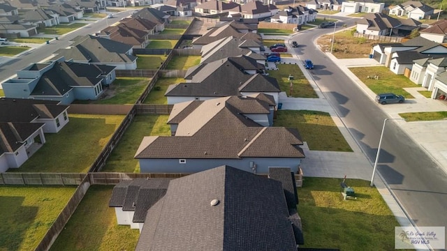 birds eye view of property with a residential view