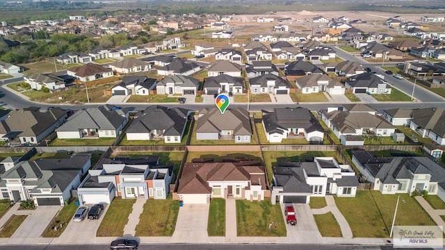 birds eye view of property with a residential view