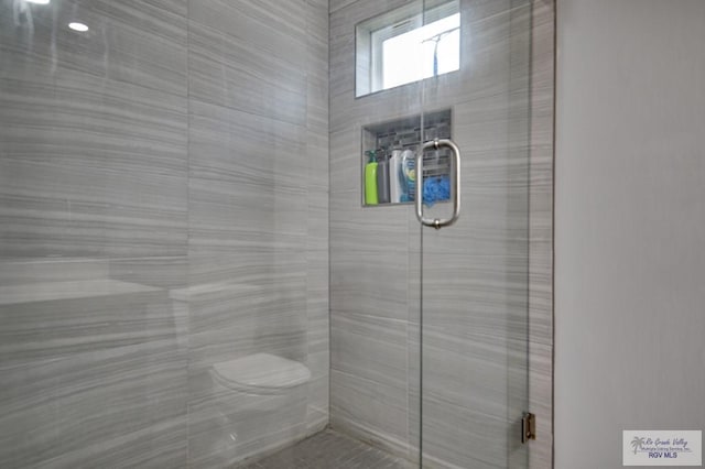 full bathroom with a shower stall