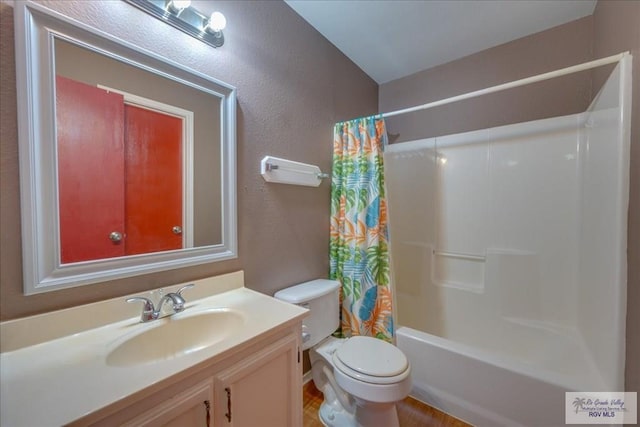 1137 Julissa Dr, Los Fresnos, TX 78566 - bathroom featuring vanity, toilet, a textured wall, and shower / bath combo