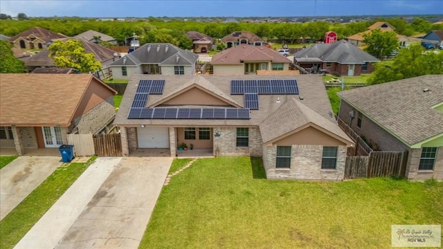 1137 Julissa Dr, Los Fresnos, TX 78566 - view of front of house featuring fence private yard, driveway, brick siding, and a residential view