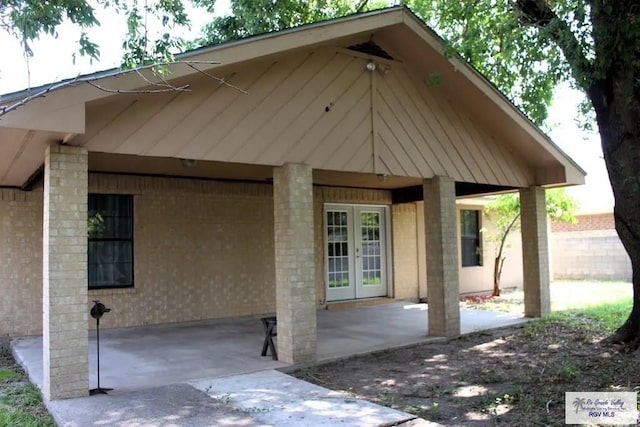 rear view of property featuring a patio and french doors