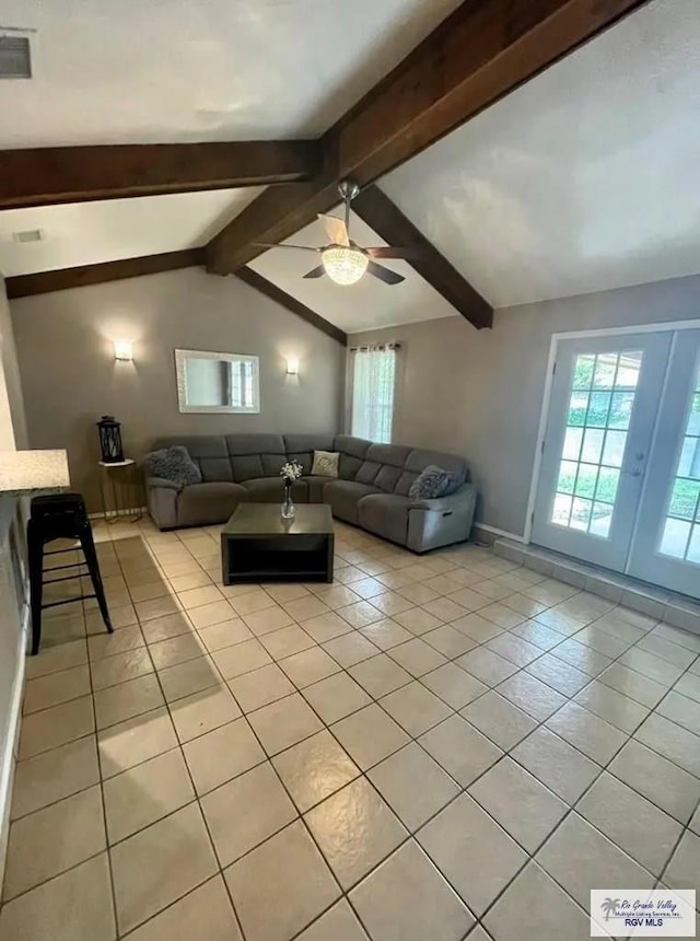 tiled living room with lofted ceiling with beams and ceiling fan