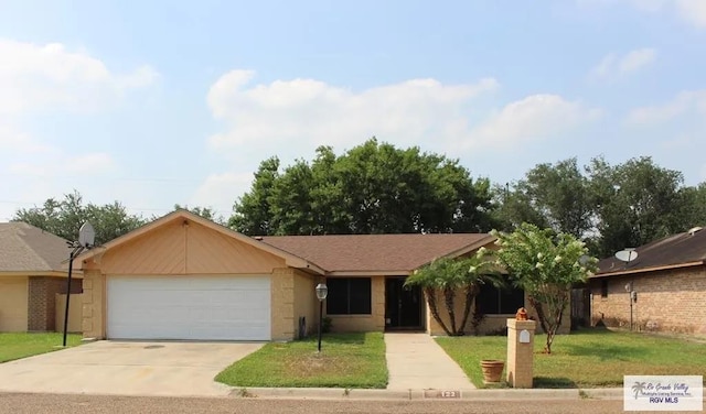 ranch-style house with a garage and a front lawn