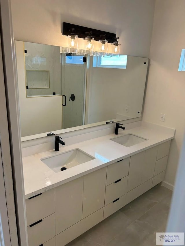 bathroom with vanity and an enclosed shower