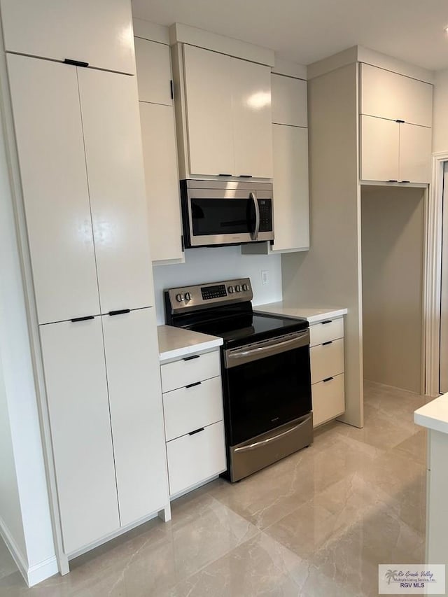 kitchen featuring white cabinets and stainless steel appliances