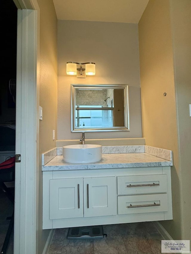 6200 Rio Sena St, Brownsville, TX 78526 - full bathroom featuring vanity, a shower, and baseboards