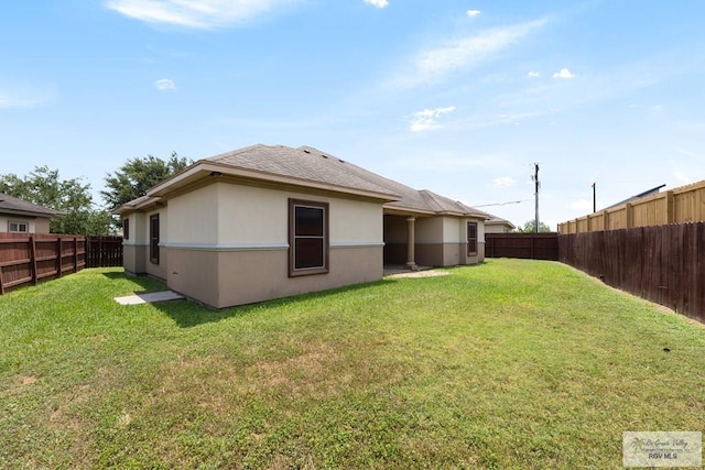 6705 Stone Oak Dr, Brownsville, TX 78526 - back of property featuring a shingled roof and stucco siding
