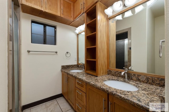 6705 Stone Oak Dr, Brownsville, TX 78526 - bathroom featuring double vanity and baseboards