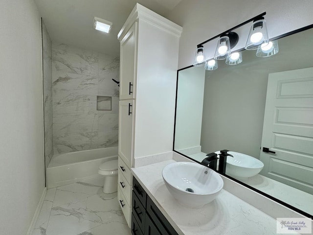 full bathroom featuring vanity, washtub / shower combination, baseboards, toilet, and marble finish floor