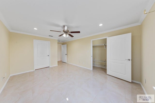 unfurnished bedroom featuring a spacious closet, ceiling fan, ornamental molding, and a closet