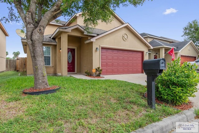 view of front of house featuring a front yard and a garage