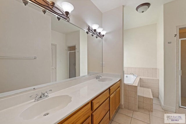 3271 Emerald Valley Blvd Unit 8, Brownsville, TX 78526 - full bath featuring tile patterned flooring, a shower stall, a garden tub, and double vanity