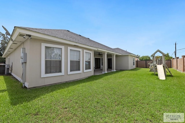 3271 Emerald Valley Blvd Unit 8, Brownsville, TX 78526 - rear view of property featuring ceiling fan, a playground, a patio, and a shingled roof