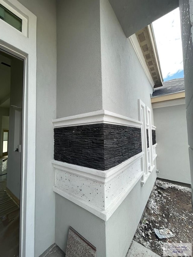 details with stone siding and stucco siding