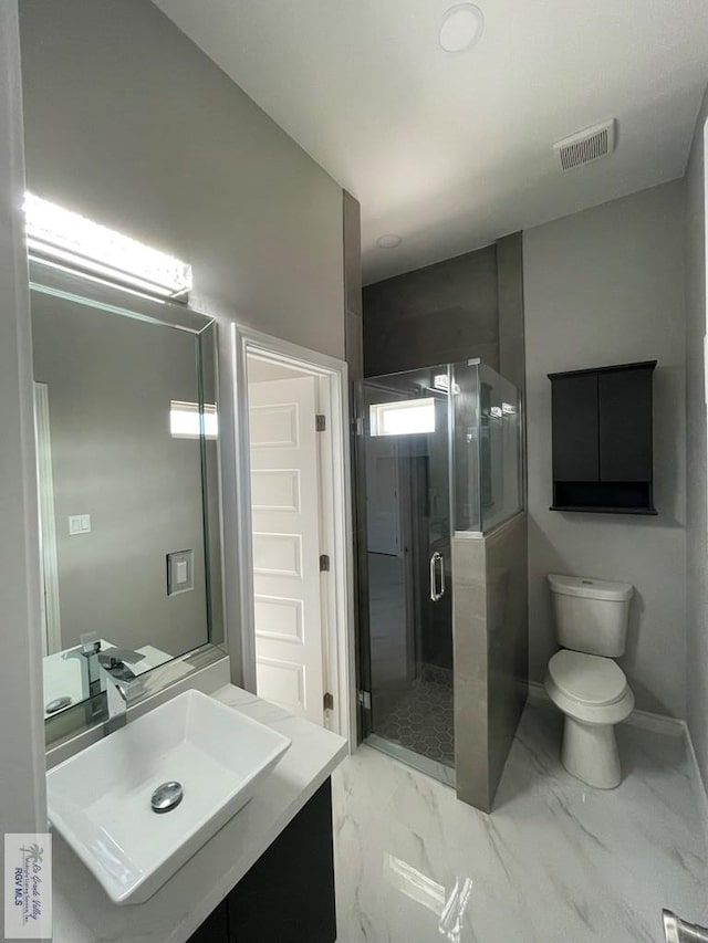 full bath featuring visible vents, toilet, marble finish floor, a shower stall, and baseboards