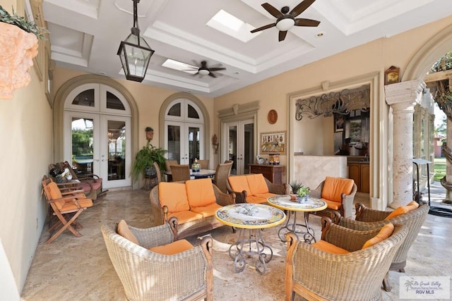 sunroom featuring french doors, a skylight, ceiling fan, and coffered ceiling