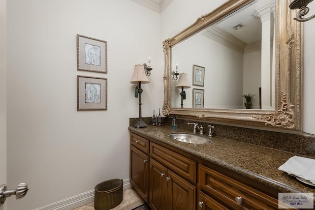 bathroom with vanity and ornamental molding