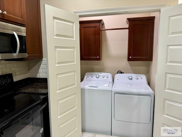 2611 E Eisenhower Ave Unit 50, Alton, TX 78573 - laundry area with cabinet space and separate washer and dryer