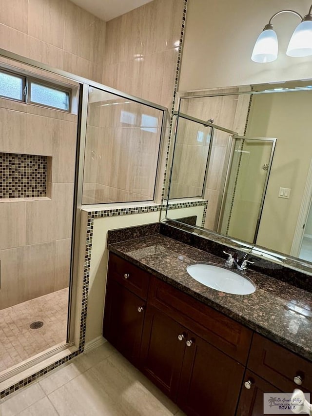 2611 E Eisenhower Ave Unit 50, Alton, TX 78573 - full bath featuring a stall shower, vanity, and tile patterned flooring