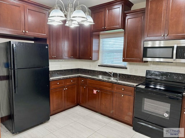 2611 E Eisenhower Ave Unit 50, Alton, TX 78573 - kitchen with black appliances, a sink, a chandelier, light tile patterned floors, and decorative backsplash