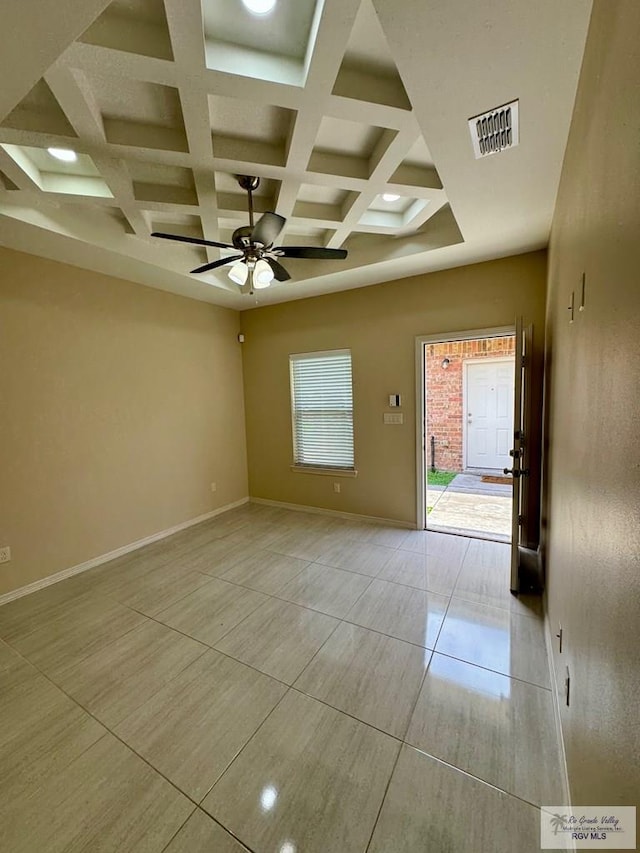 2611 E Eisenhower Ave Unit 50, Alton, TX 78573 - spare room featuring ceiling fan, coffered ceiling, beam ceiling, baseboards, and light tile patterned flooring