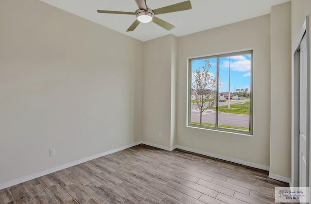 1829 Stirrup Cir, San Benito, TX 78586 - empty room featuring wood finished floors, ceiling fan, and baseboards