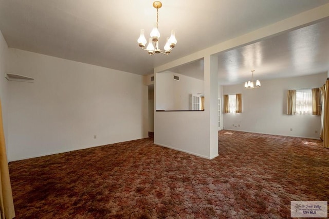 interior space featuring a chandelier and carpet flooring