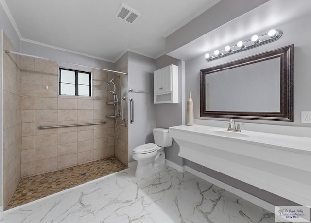23570 Stuart Place Rd, Harlingen, TX 78552 - full bath with toilet, a tile shower, crown molding, vanity, and baseboards