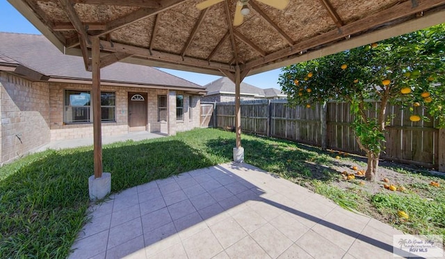 view of patio / terrace featuring a ceiling fan and fence private yard