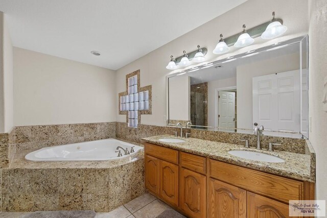 bathroom featuring vanity, tile patterned floors, and separate shower and tub