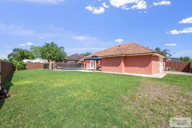 view of yard featuring a gazebo and a pool