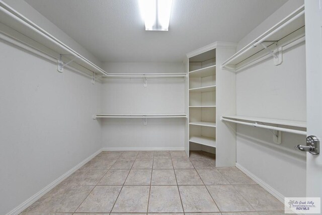 walk in closet featuring tile patterned floors