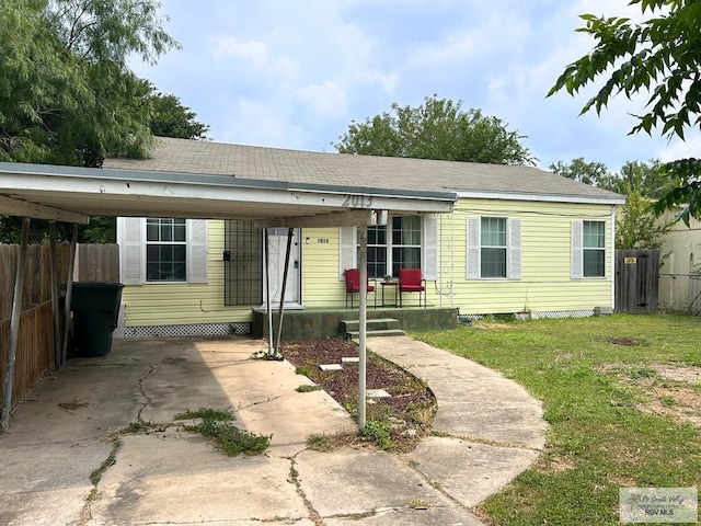 2013 E Jackson St, Harlingen, TX 78550 - view of front facade featuring a carport, driveway, and a porch